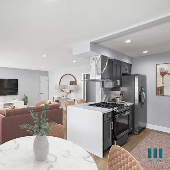 open-concept kitchen with countertop bar and dining area