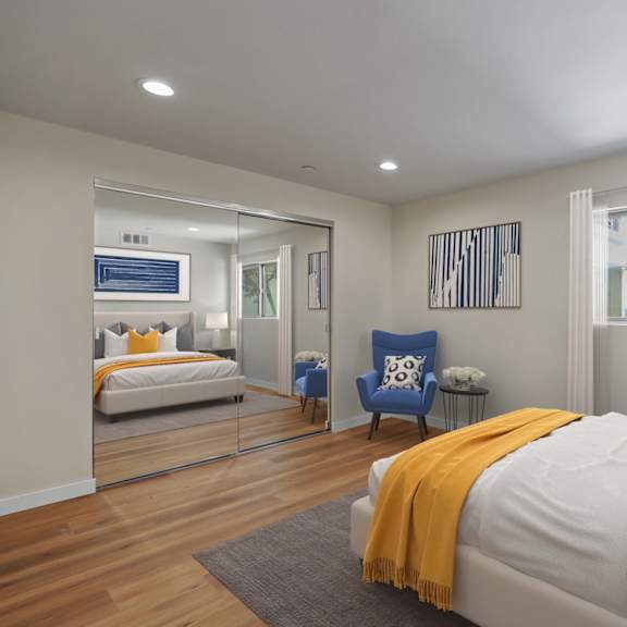 bedroom with mirrored closet, vinyl flooring, and large-size windows