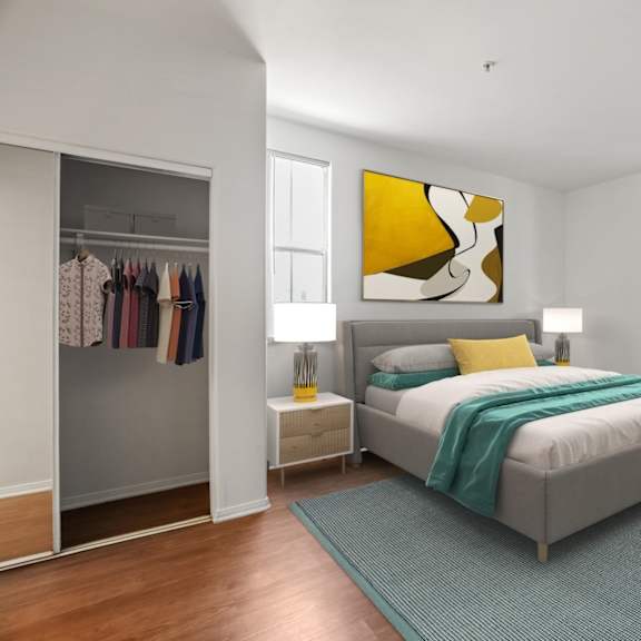 bedroom with mirrored closet, vinyl flooring, and large-size windows