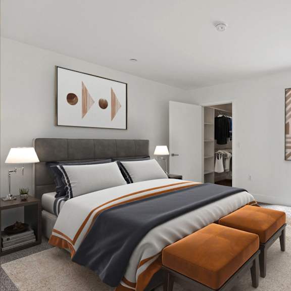 bedroom with walk-in closet with built-in organizers