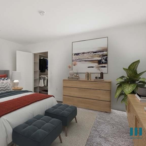 bedroom with walk-in closet with built-in organizers