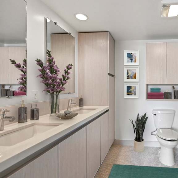 bathroom with walk-in shower & glass door, and vanity cabinet storage