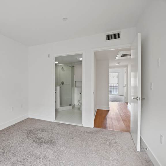 bedroom and a bathroom with a stand-up shower