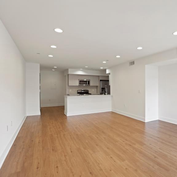 open-concept kitchen, dining, and living room areas