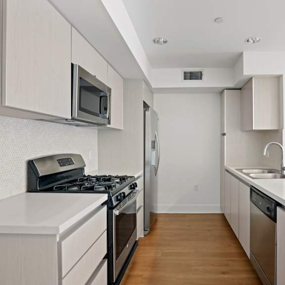 kitchen with stainless steel appliances and ample cabinet storage