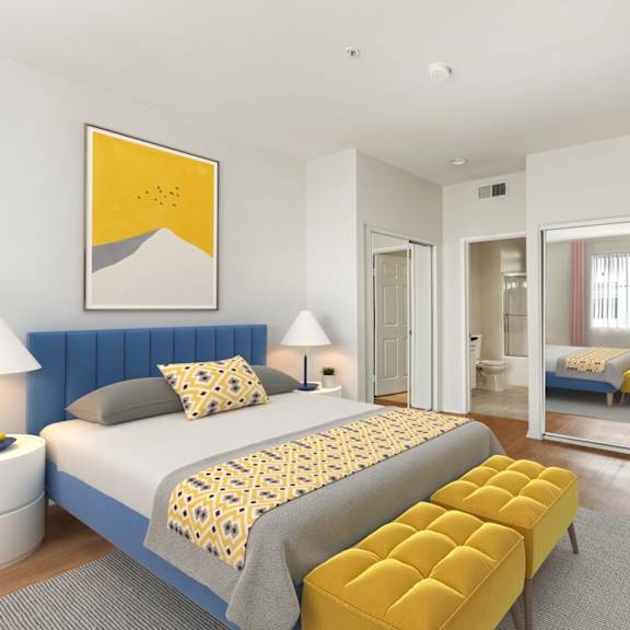 spacious bedroom with two-mirrored closets and bathroom