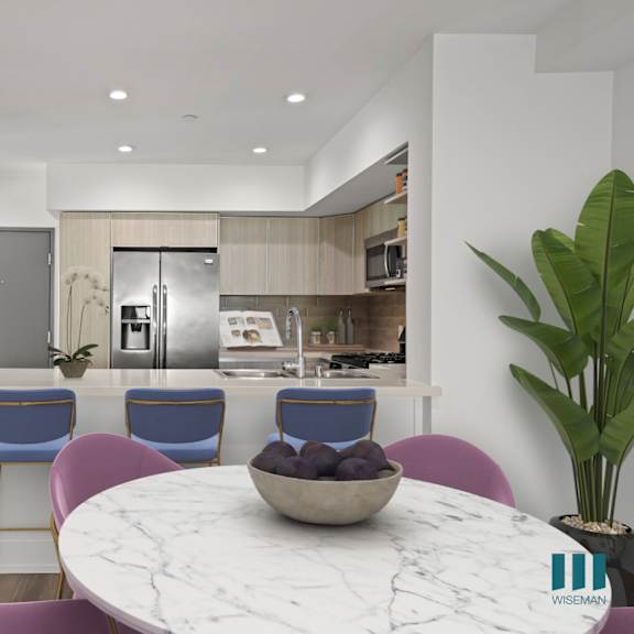 front entrance and open-concept kitchen with countertop bar