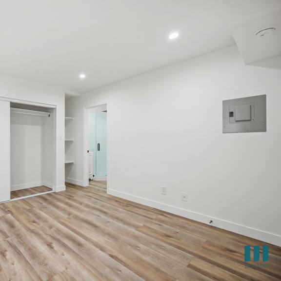 a room with a white door and a white wall.