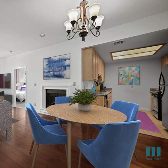 a living room with a dining table and chairs.
