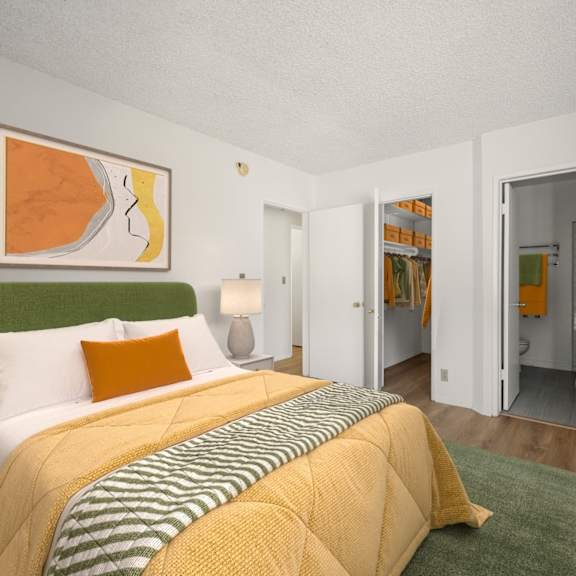 bedroom with in-suite bathroom and closet