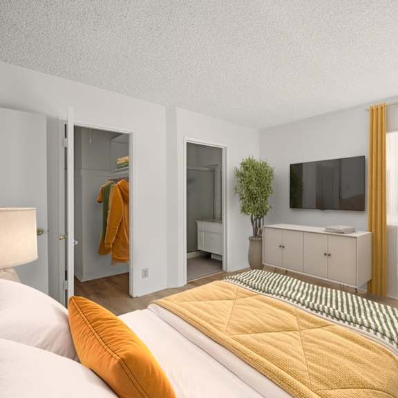 bedroom with in-suite bathroom and closet