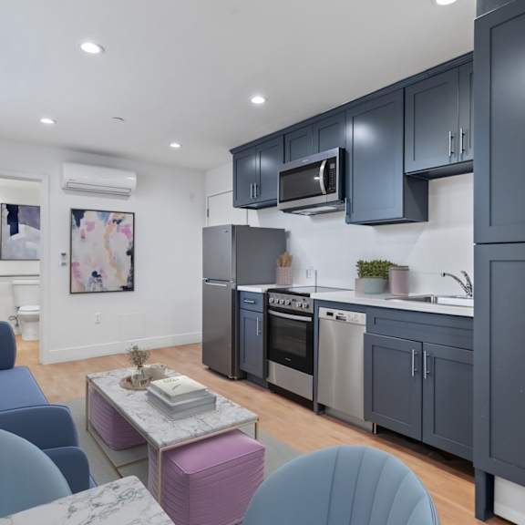 studio unit with full-kitchen , bedroom, and living room space