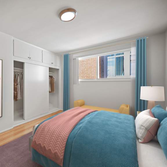 bedroom with multiple closets and built-in cabinets