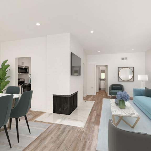 dining and living room with electric fireplace, vinyl flooring, and recessed lighting