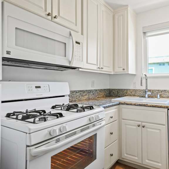 kitchen with refrigerator, stove, dishwasher, and microwave oven