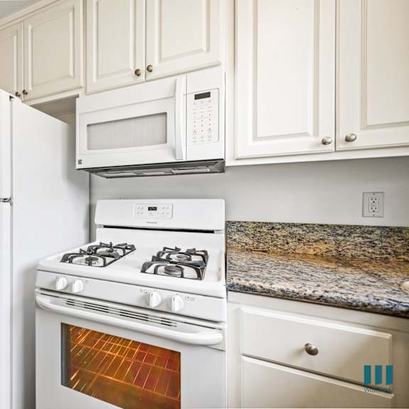 kitchen with refrigerator, stove, and microwave oven