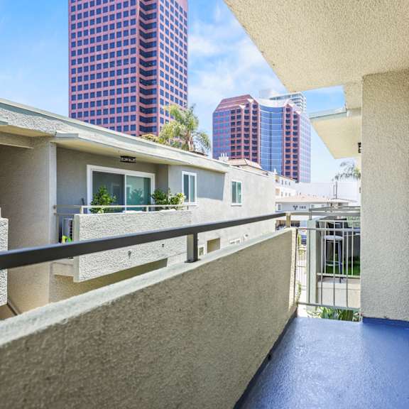 a balcony with a view of the city.