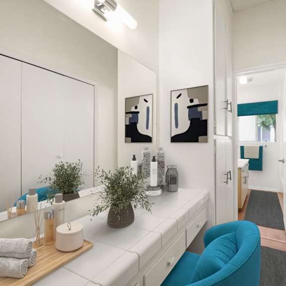 a bathroom with a white counter and a blue chair