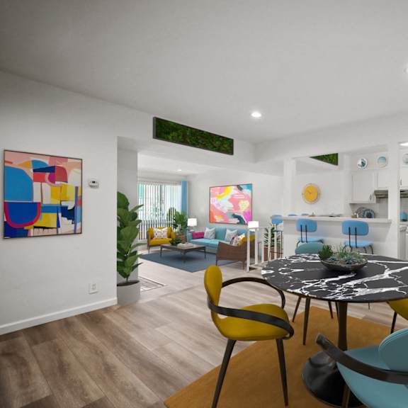 a modern dining room with a round table and chairs.