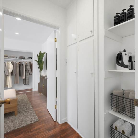hallway with built-in cabinet storage and shelving
