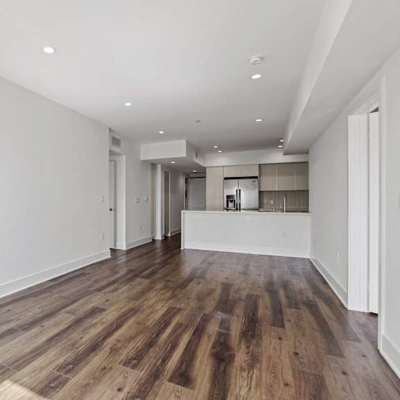 open-concept kitchen, dining, and living room space