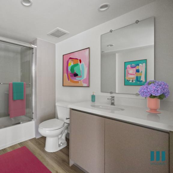 bathroom with shower-bath with glass door and vanity cabinet storage