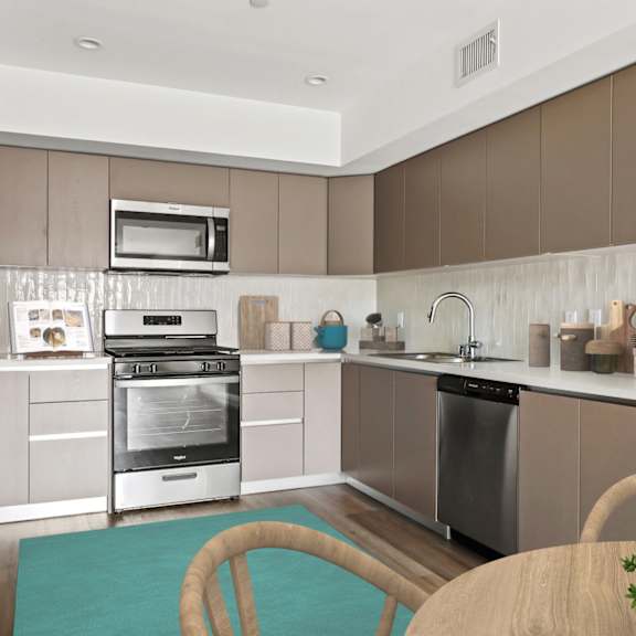 a modern kitchen with stainless steel appliances and wooden cabinets