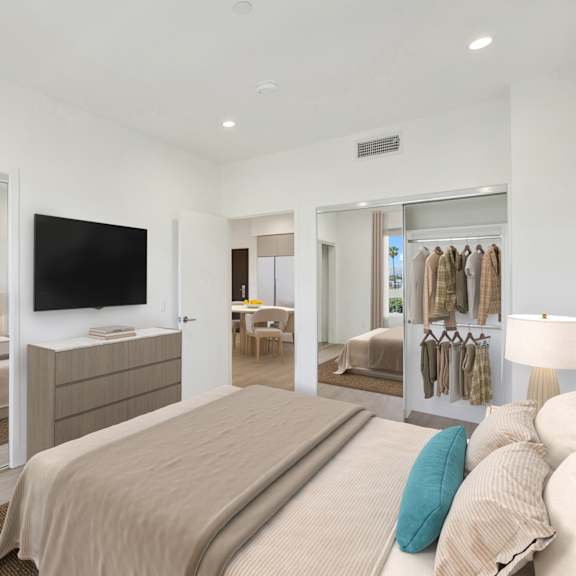 a bedroom with a large bed and a walk-in closet.