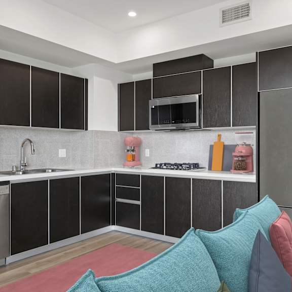 kitchen with stainless-steel appliances at ogden garden by wiseman, los angeles, ca