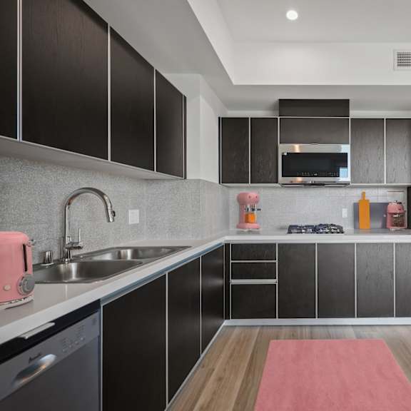 kitchen with range stovetop at ogden garden by wiseman, los angeles, ca, 90036