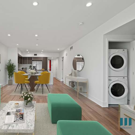 kitchen, dining, and living room area with in-suite washer & dryer