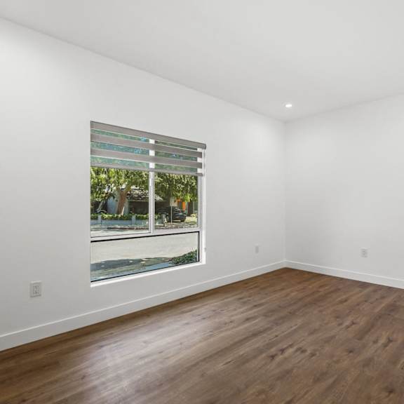 bedroom with large-size windows, recessed lighting, and vinyl floors
