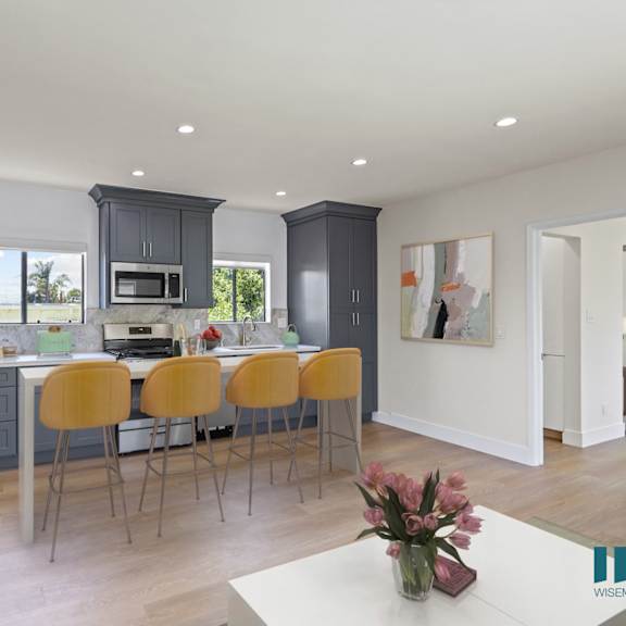 open-concept kitchen energy-efficient appliances and with countertop island bar