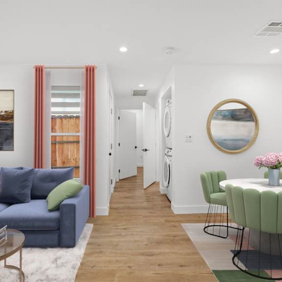 open-concept living and dining room with in-suite washer & dryer