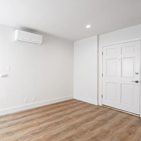 spacious studio apartment with central ac and vinyl flooring