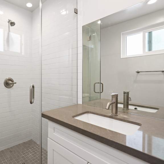 studio apartment with full-size bathroom and stand-up shower