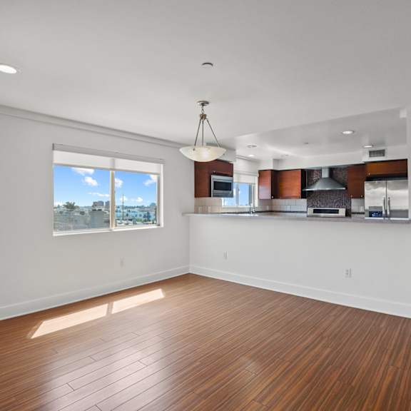 open-concept kitchen, dining, and living room spaces