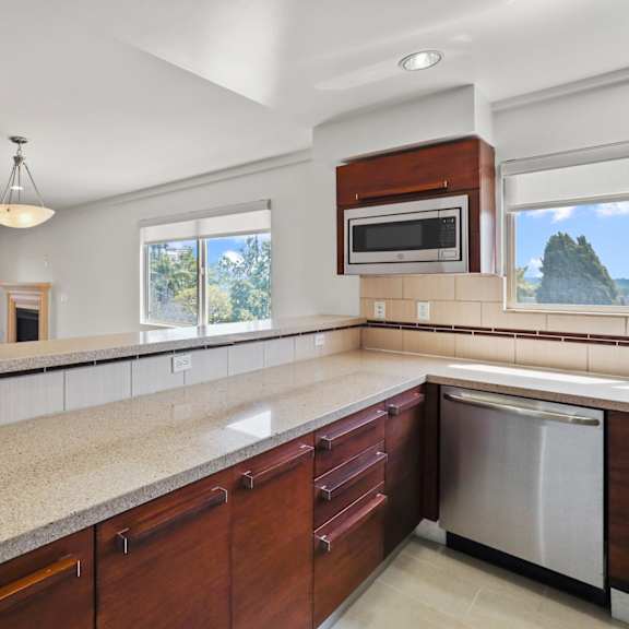 open-concept kitchen, dining, and living room spaces