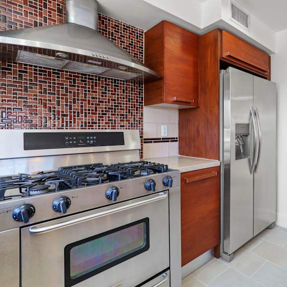 kitchen with six burner stainless gas stove cooktop