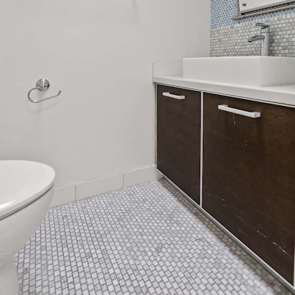 spacious bathroom with double-cabinets for storage