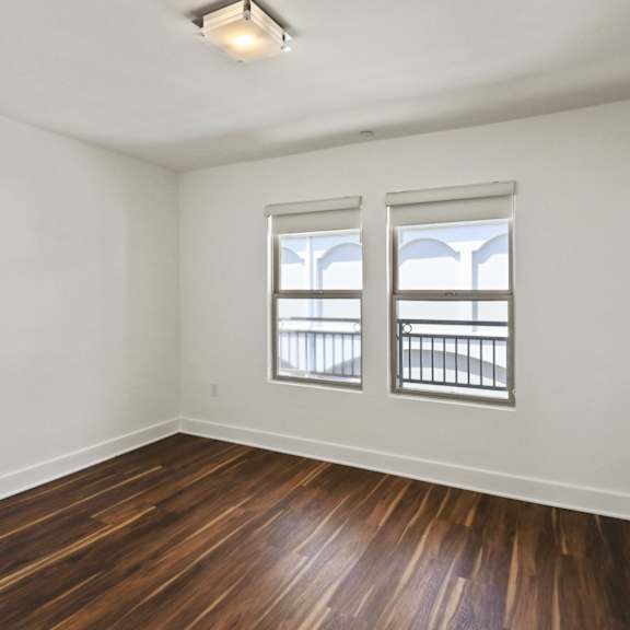 bedroom with double windows and closet