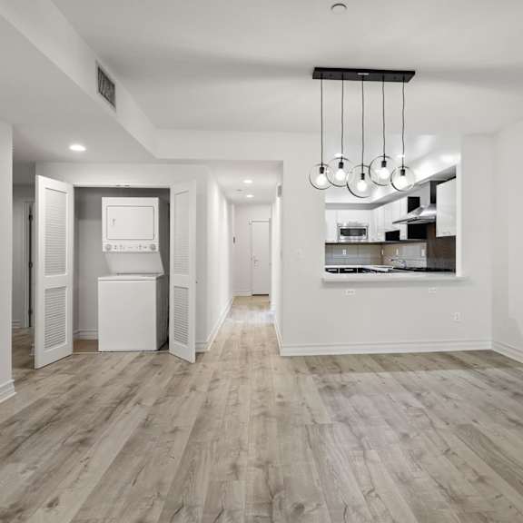 open-concept kitchen and dining space and in-suite washer & dryer