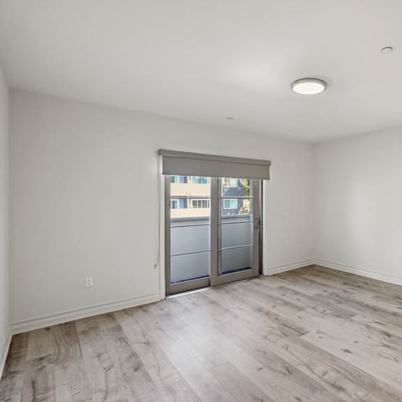 spacious living room with balcony