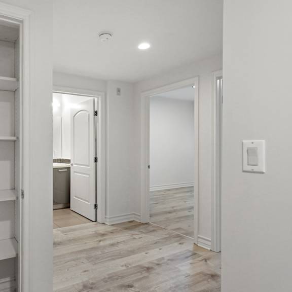 hall closet with built-in shelving