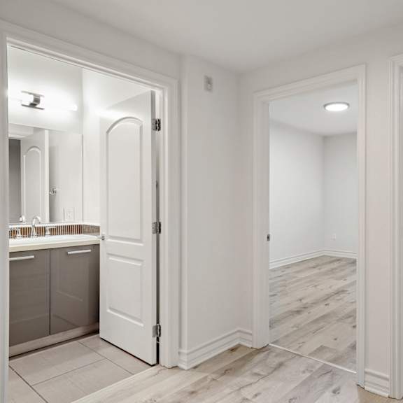 hallway entrance to bedrooms and a bathroom