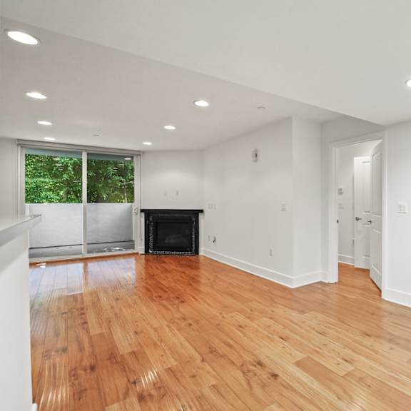 dining and living room spaces with access to patio