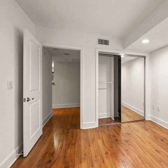 bedroom with mirrored closet