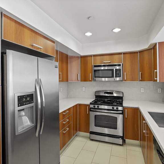 kitchen with energy-efficient refrigerator, stove, microwave oven, and dishwasher