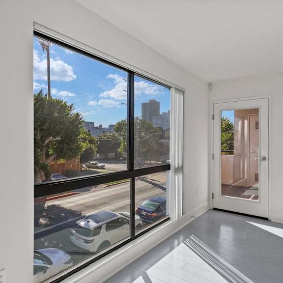 window & patios off of the living room