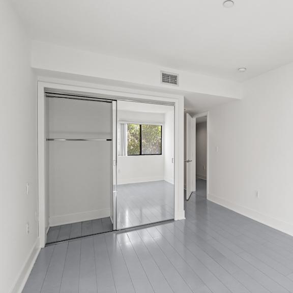 bedroom facing closet and entrance